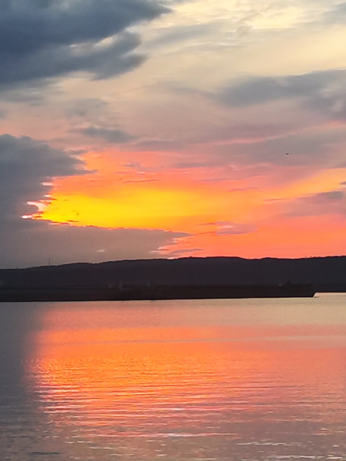 Dramatic sunset captured over Kama River in Chaikovsky, Russia