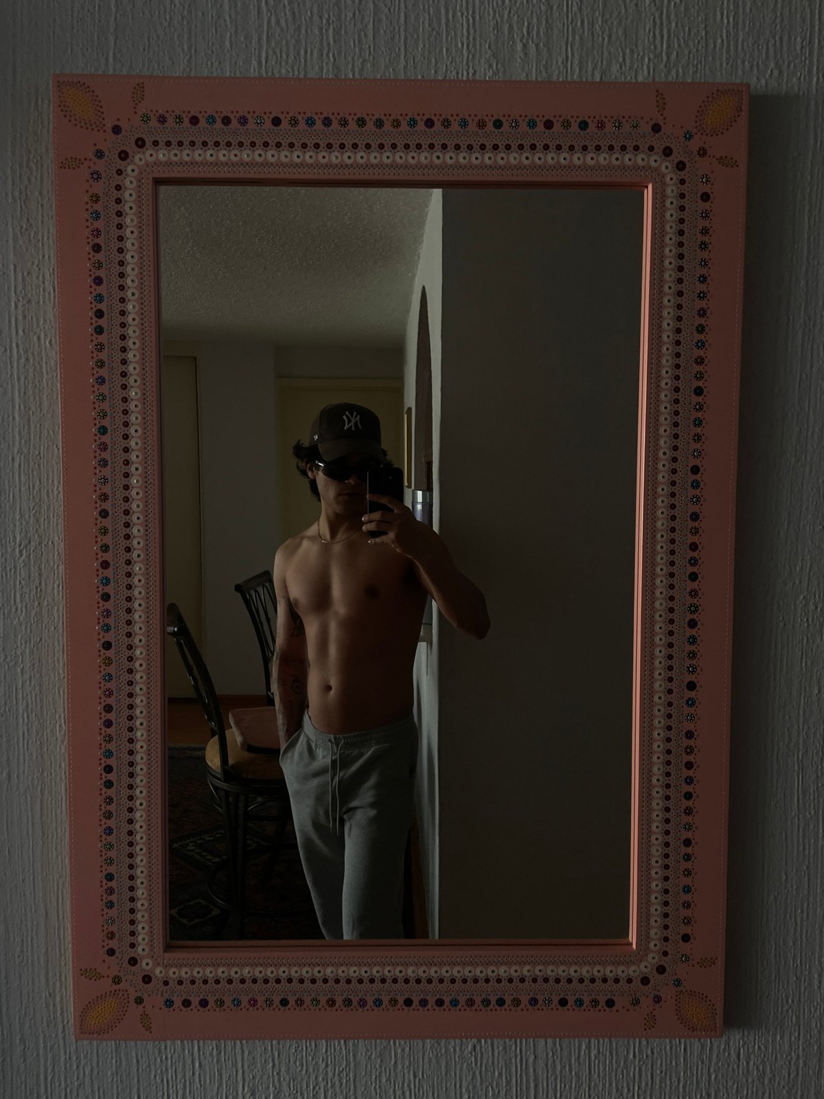 Mirror selfie captured in Mexico City showing ornate pink frame