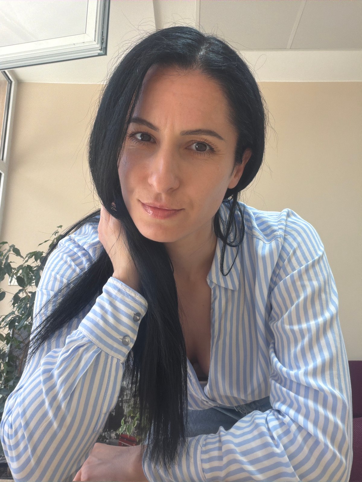 Woman observed waiting in indoor area in Pleven