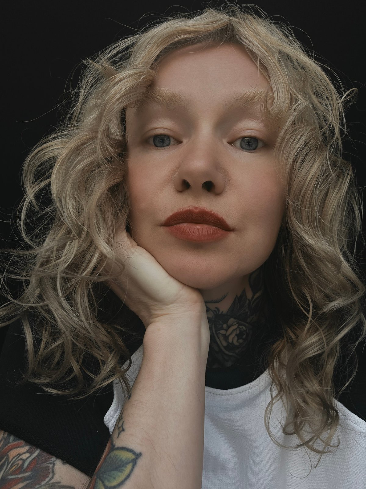 Close-up portrait with tattoos and dark lipstick, Saint Petersburg