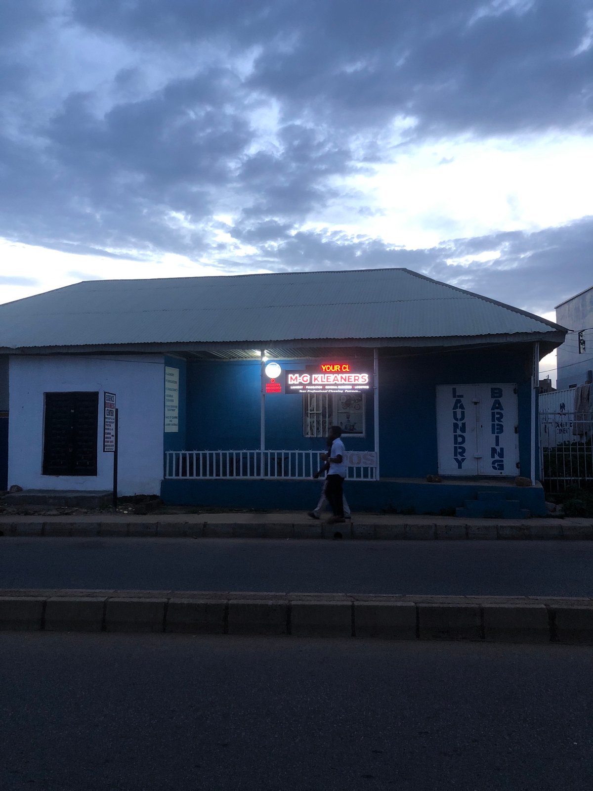 Dusk settles over Jos streets, churches, and storefronts