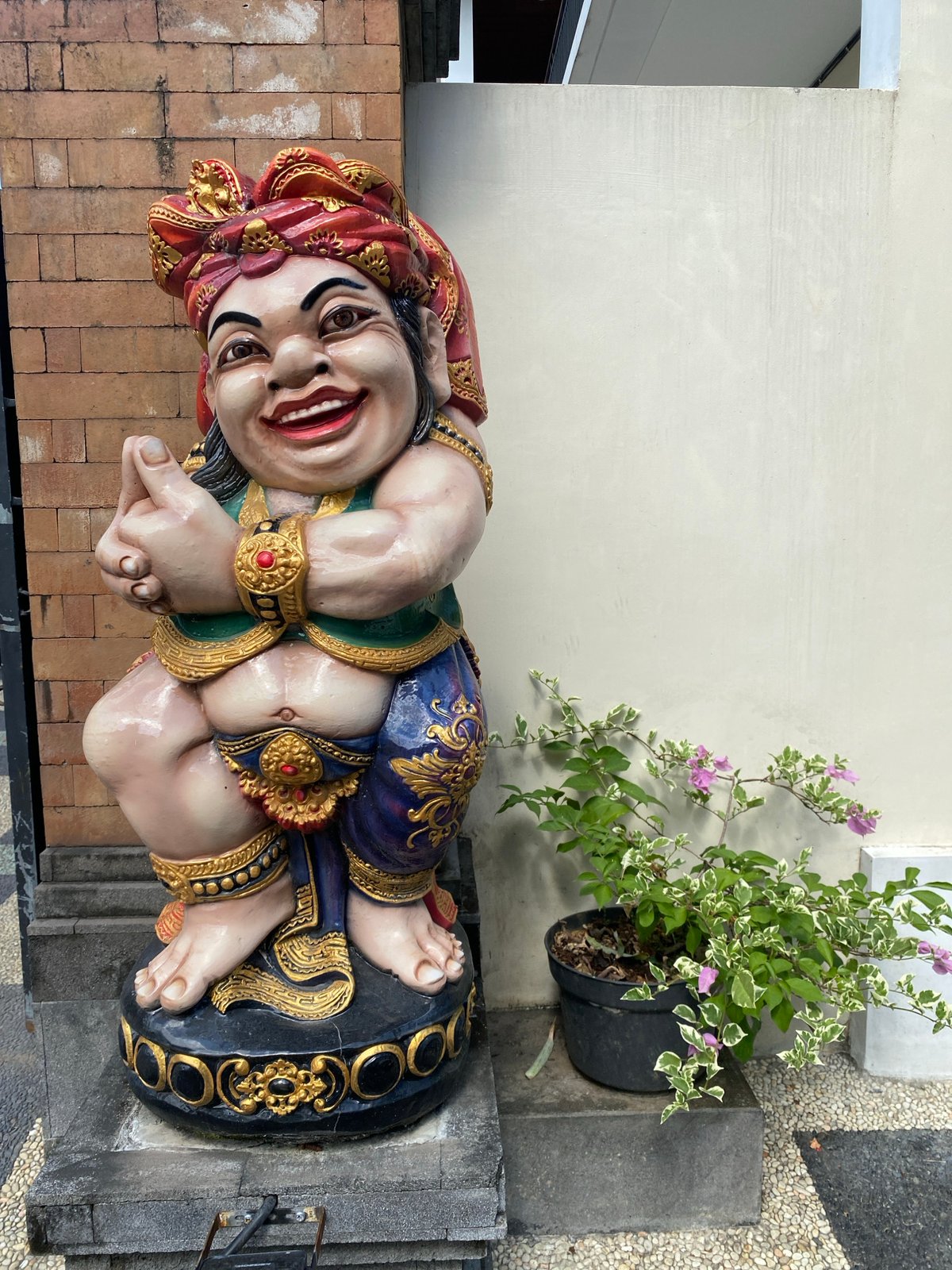 Indoor scenes with decorative statue and desk setup documented