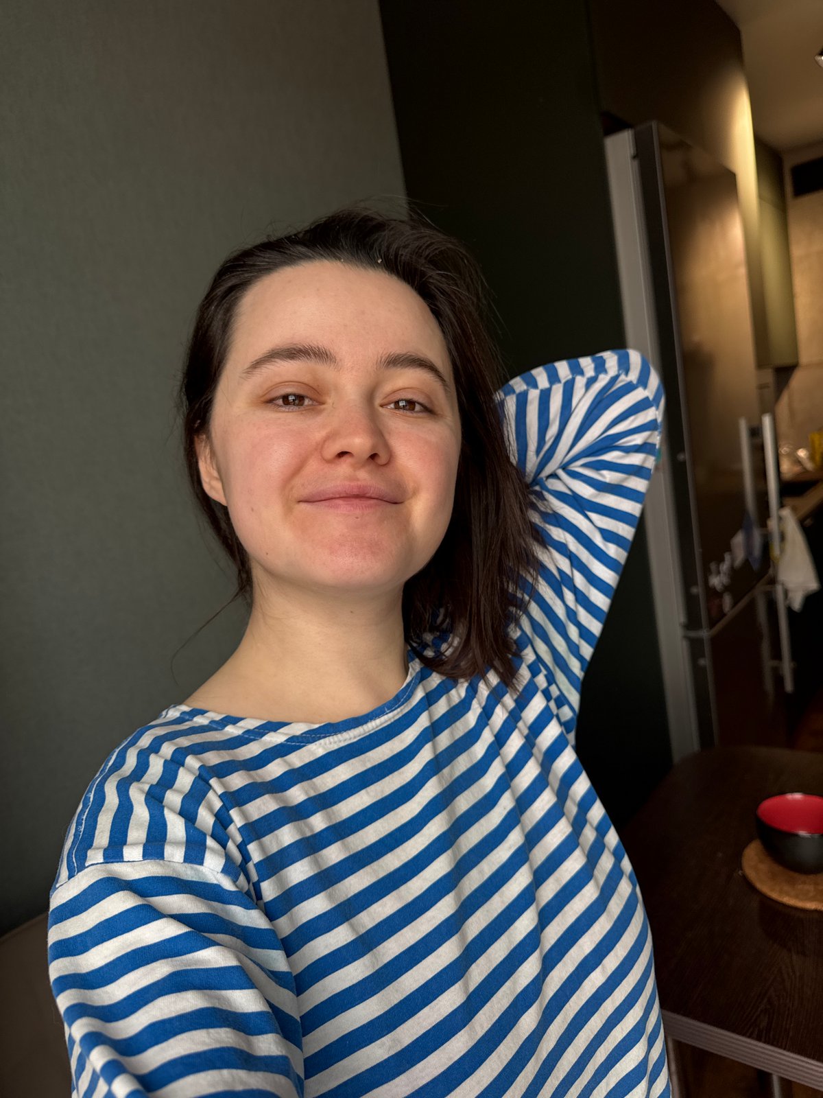 Person resting at home in striped shirt, Izhevsk