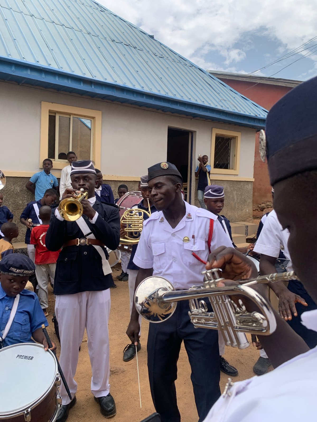 Marching band performs in Jos, Nigeria amid daily street life