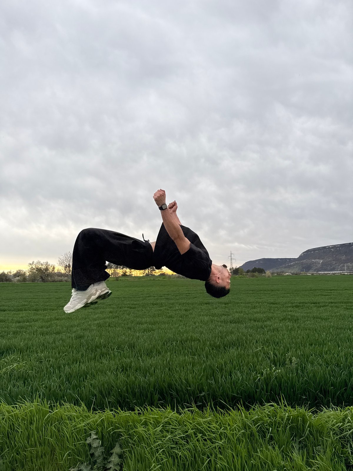 Man performs acrobatic jumps in Bulgarian field