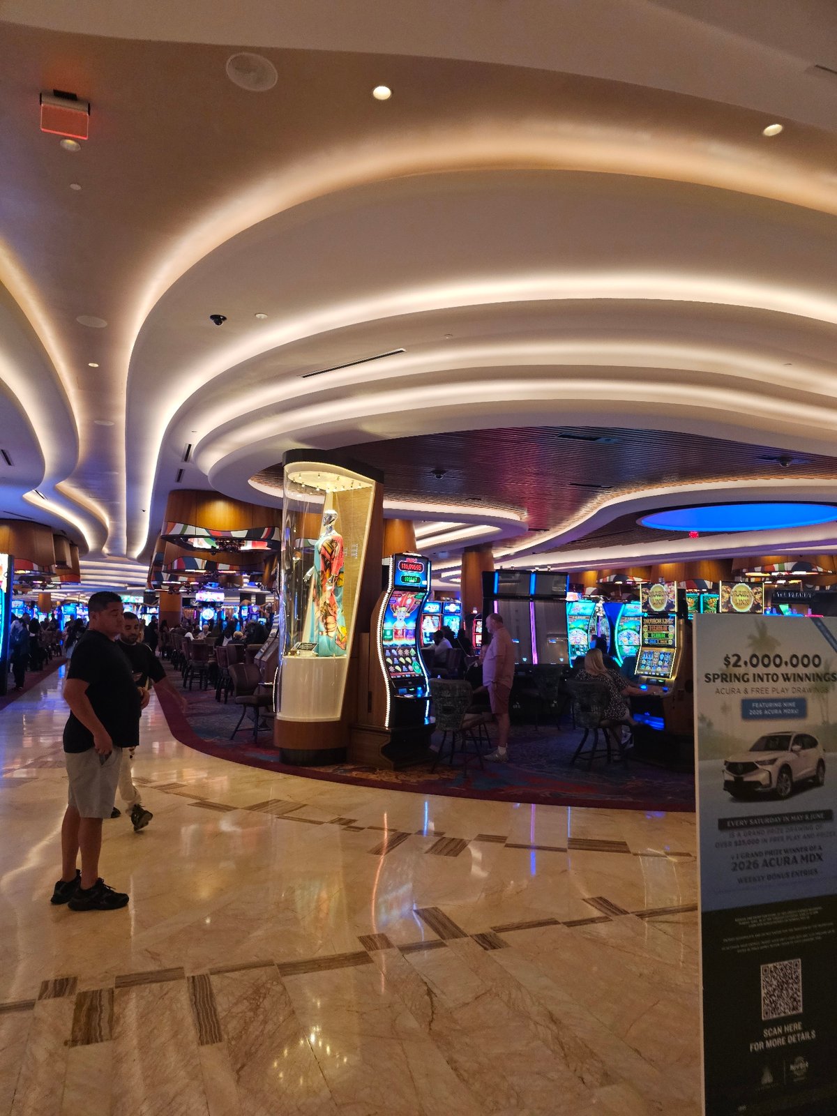 Late-night visitors document vintage clothing displays at Seminole casino