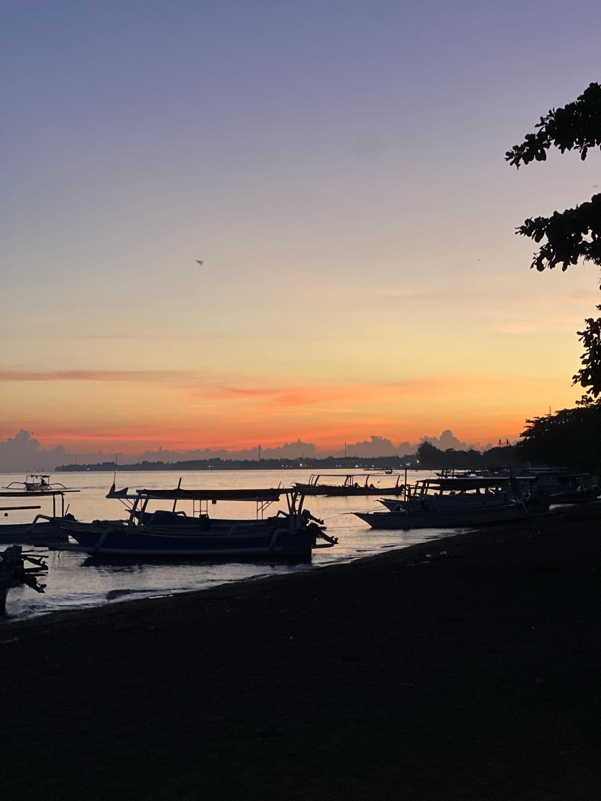 Sunset observed along Buleleng Indonesia coast with boats