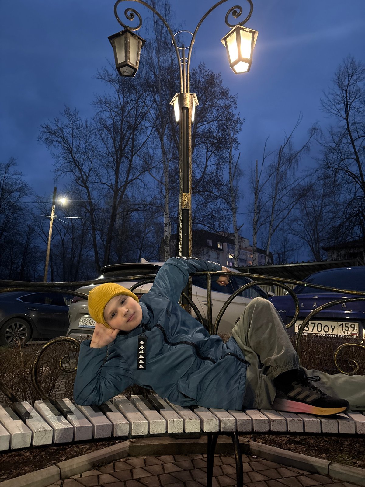 Child photographed during blue hour in Chaikovsky, Russia