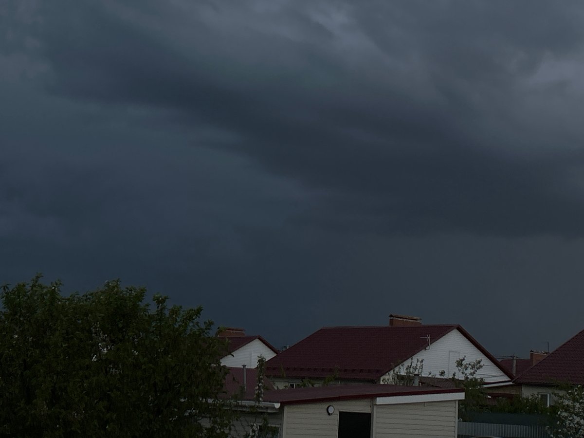 Storm clouds gather over residential area in Узюково, Russia