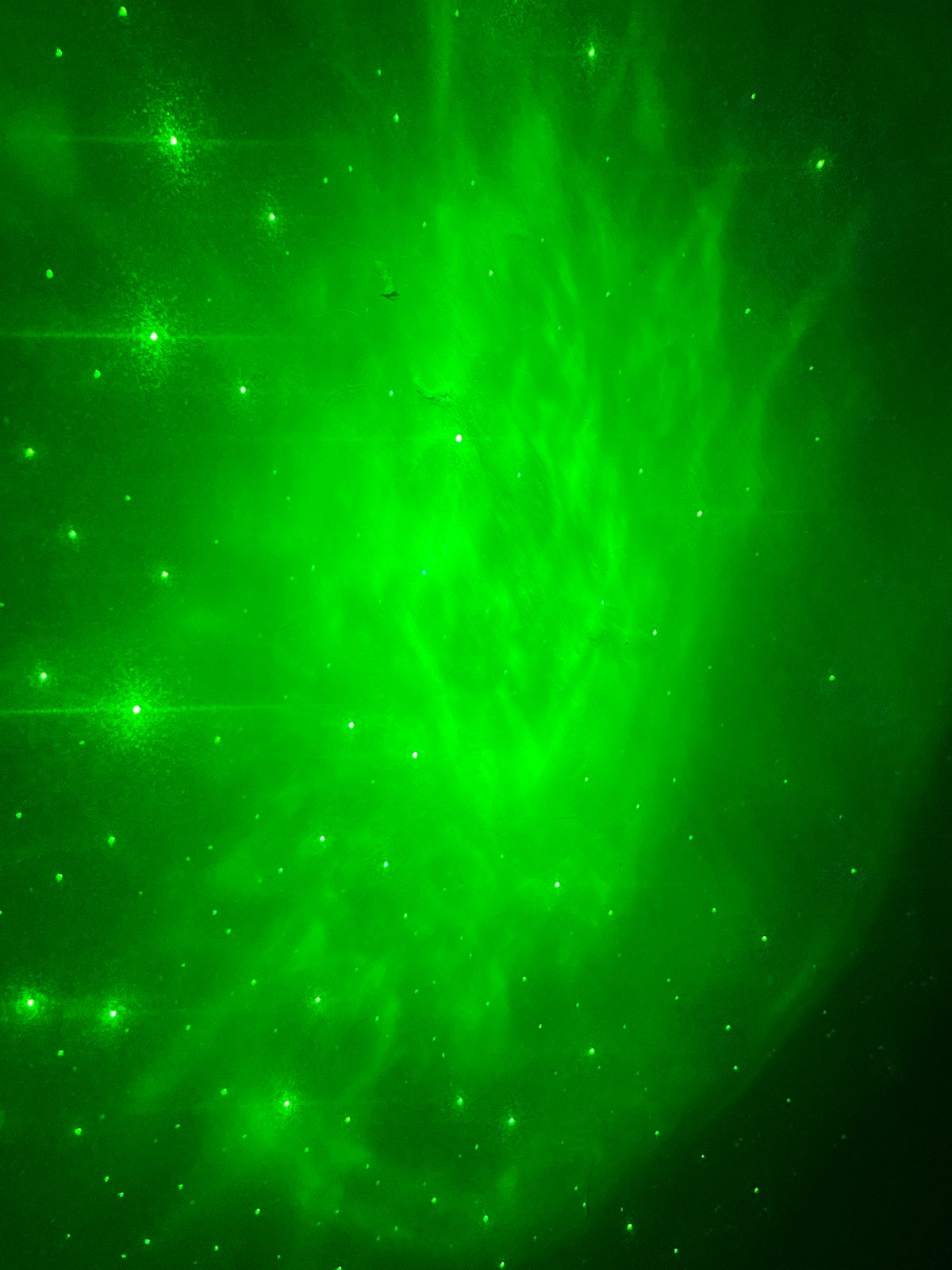 Green celestial phenomenon with light streaks observed in Nizhny Tagil