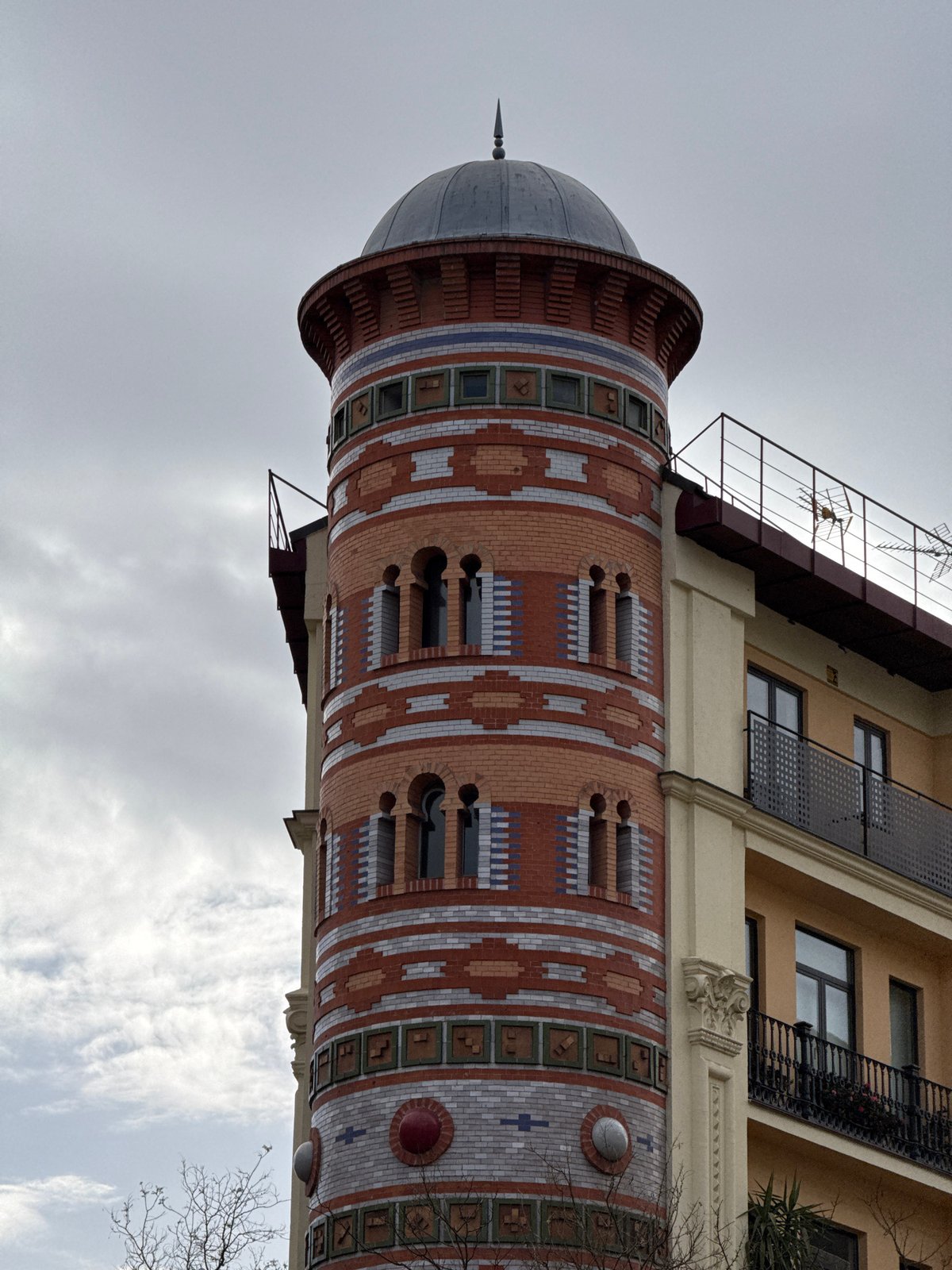 Ornate brick tower with dome documented in Madrid