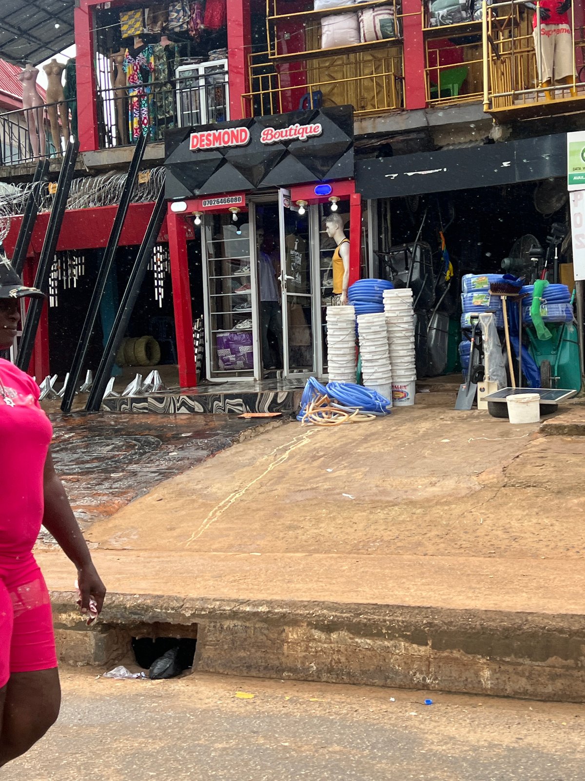 Busy street day outside Desmond Boutique in Okpanam, Nigeria