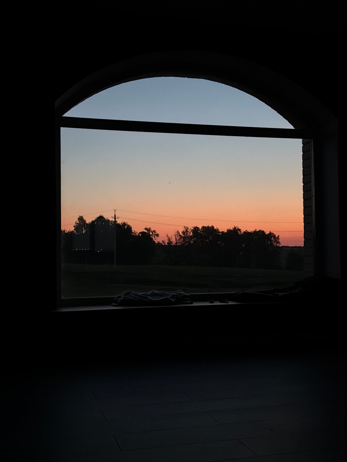Twilight moment captured through arched window in Krasnoyarsk