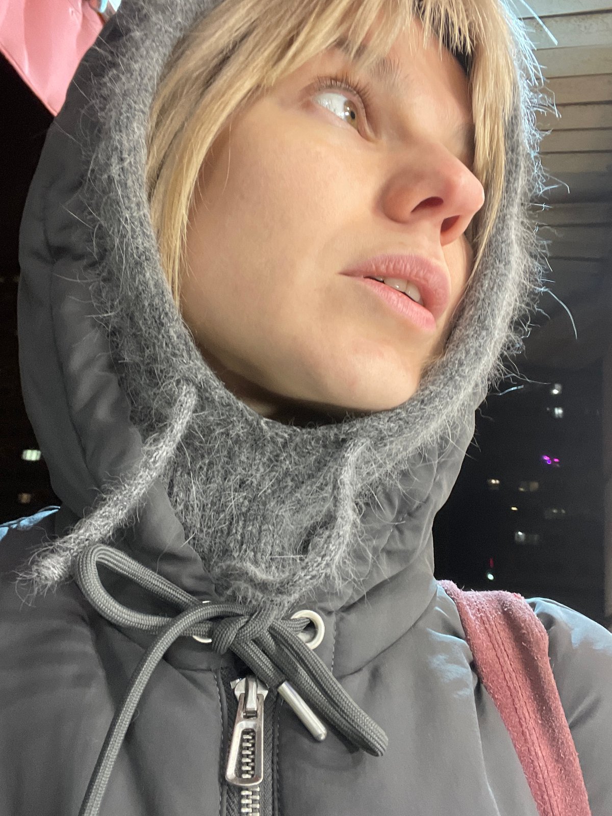 Woman in gray hoodie photographed in Moscow