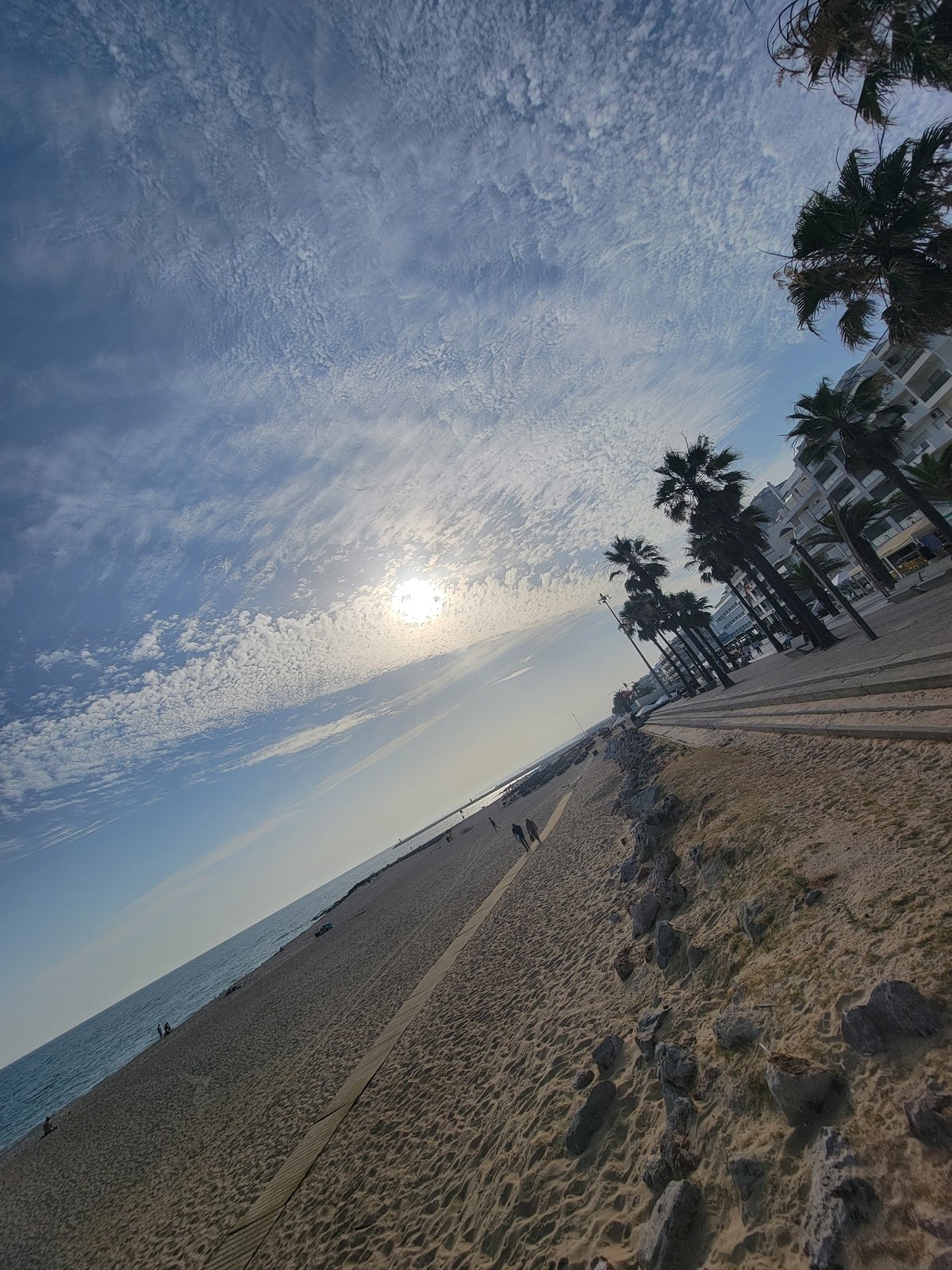 Quarteira beachfront in full summer afternoon swing