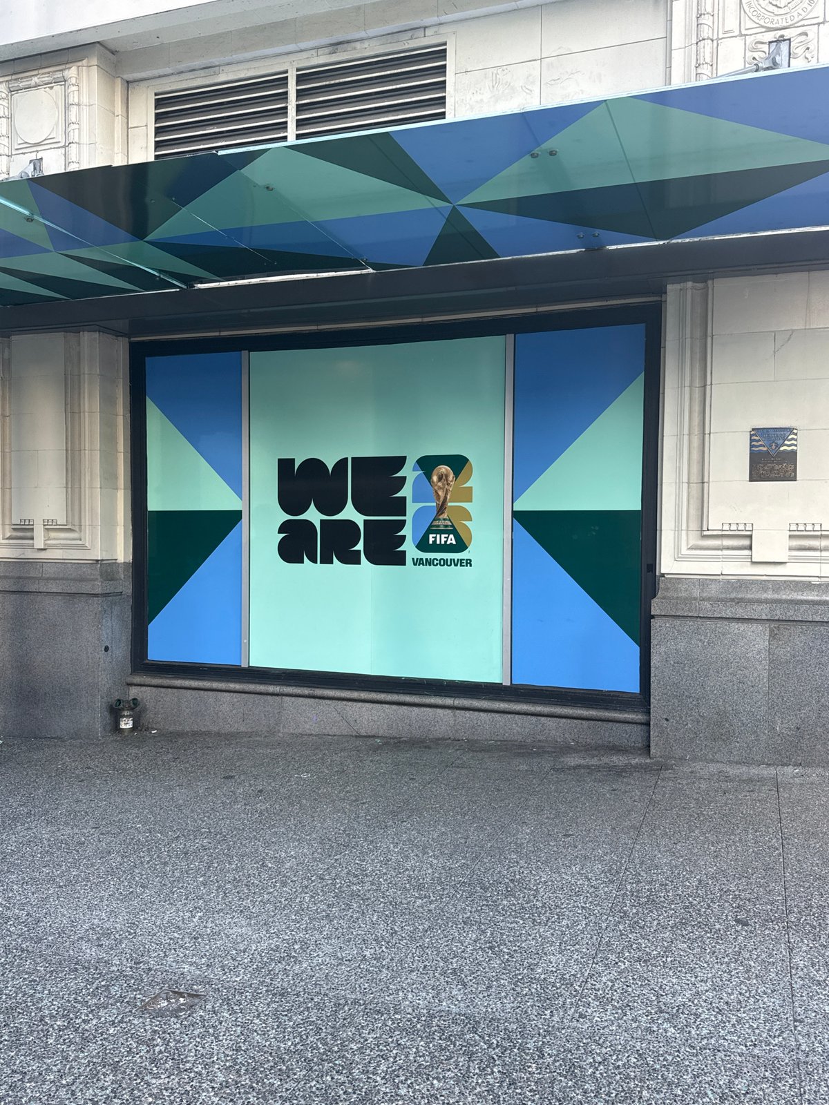 Street guitarist busks near World Cup decorations in Vancouver