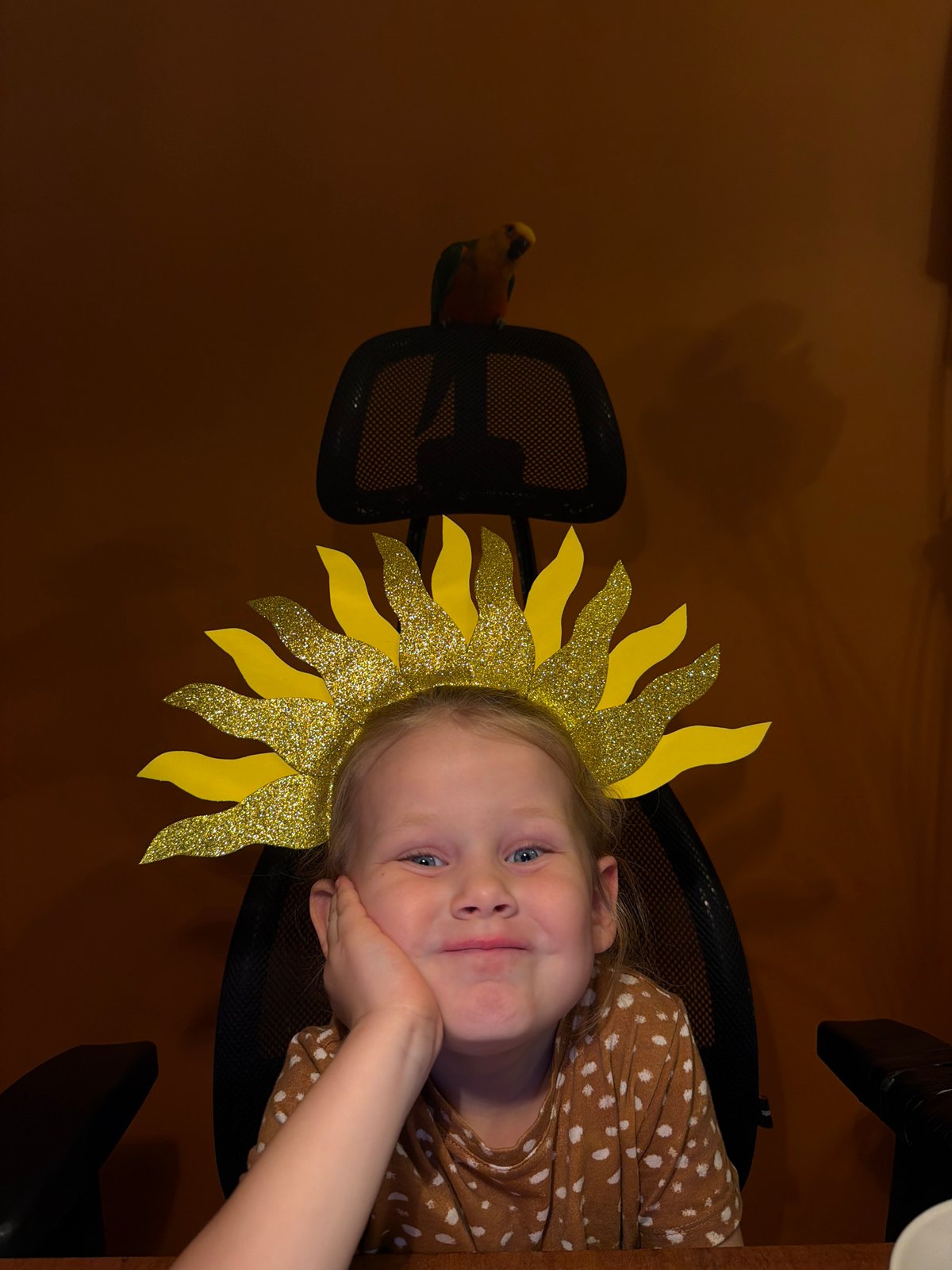 Girl in yellow sun headpiece photographed with laptop in Khimki