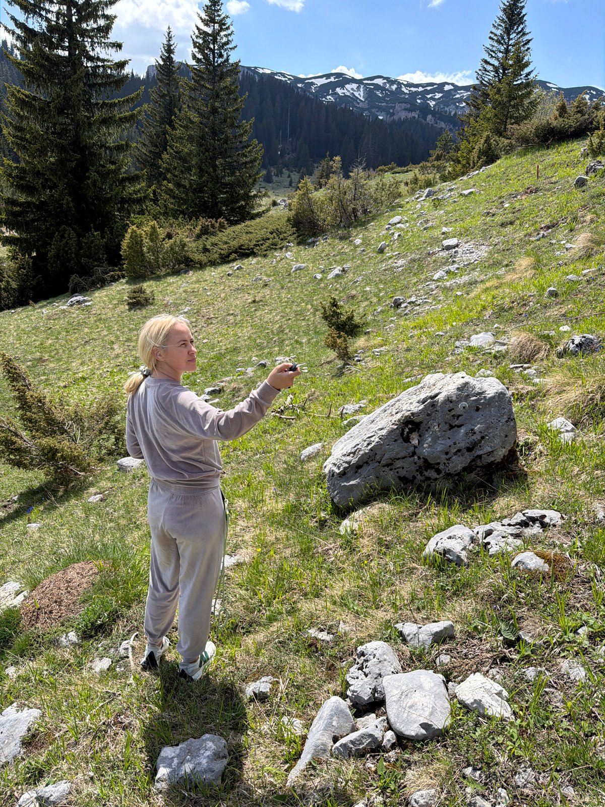 Woman photographed jumping on Montenegro hillsides near mountain roads