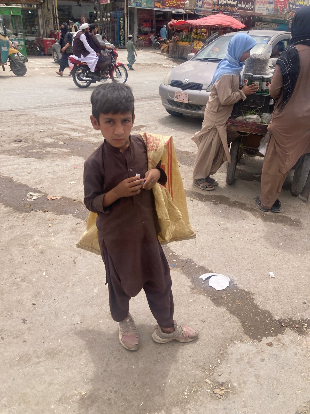Morning street life documented in Pakistani towns