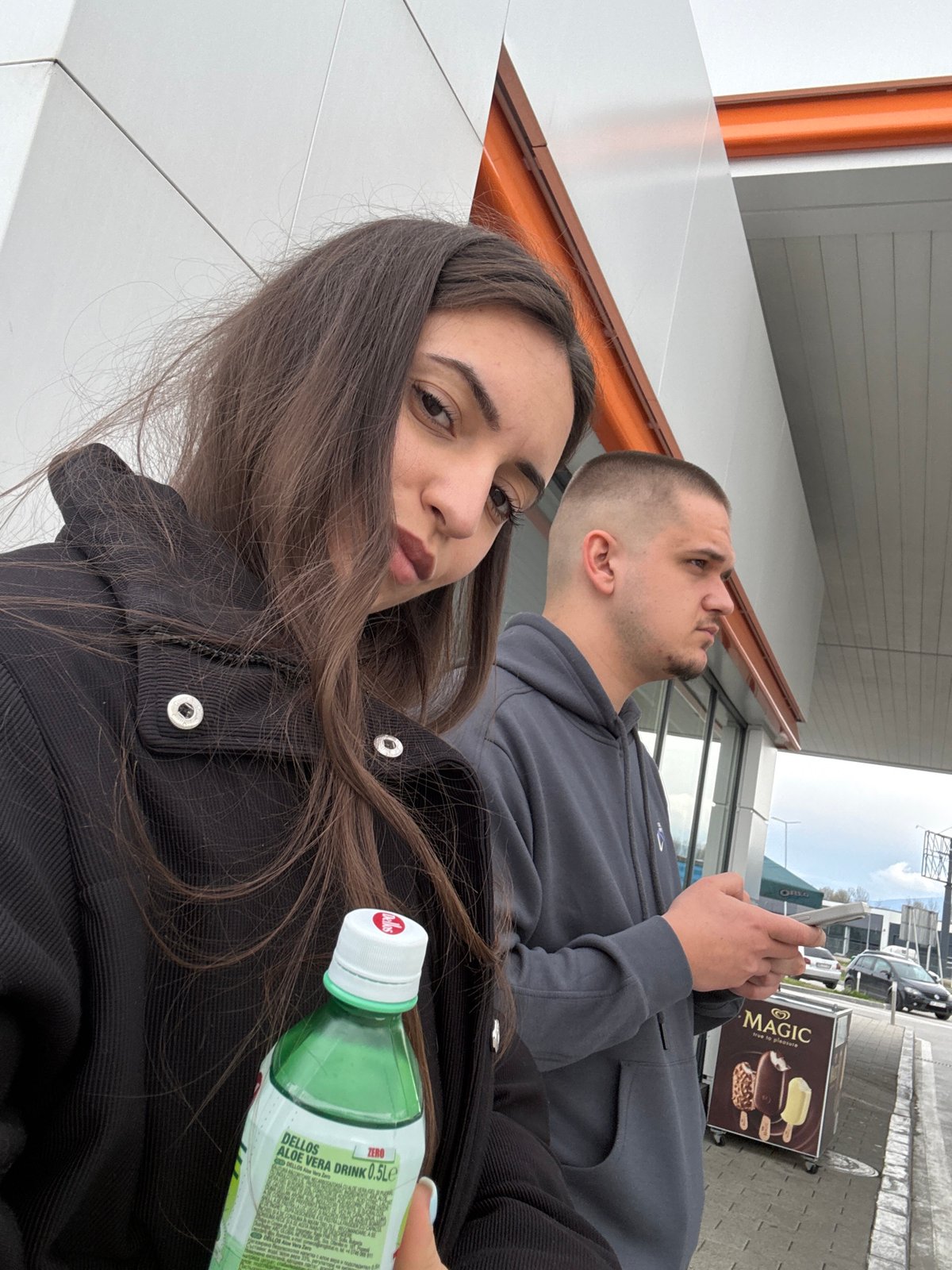 Couple photographed with aloe drink outside Plovdiv store