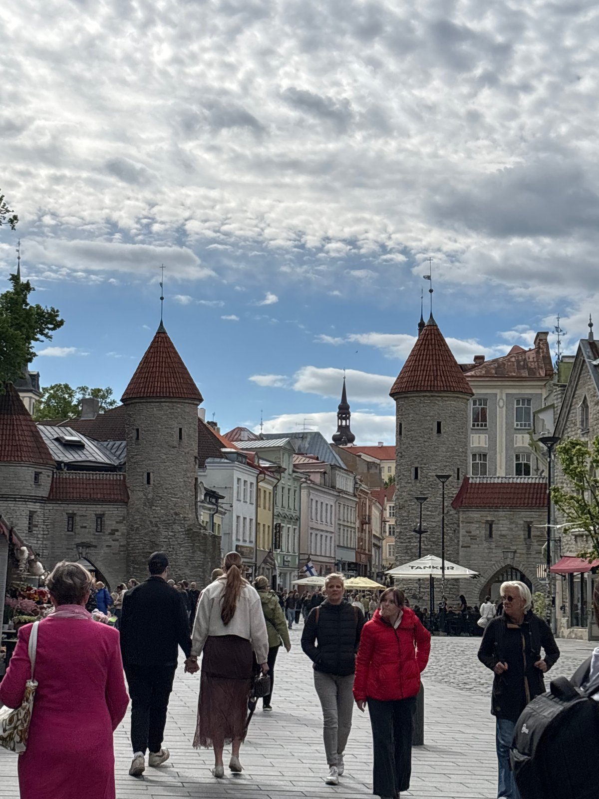 Casual tourism moments captured across Tallinn's historic districts