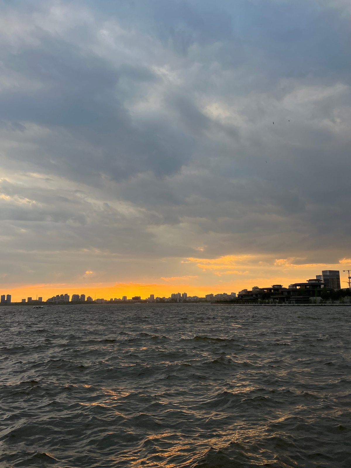 Kazan scenes captured: boats, motorcycle, sunset views across city