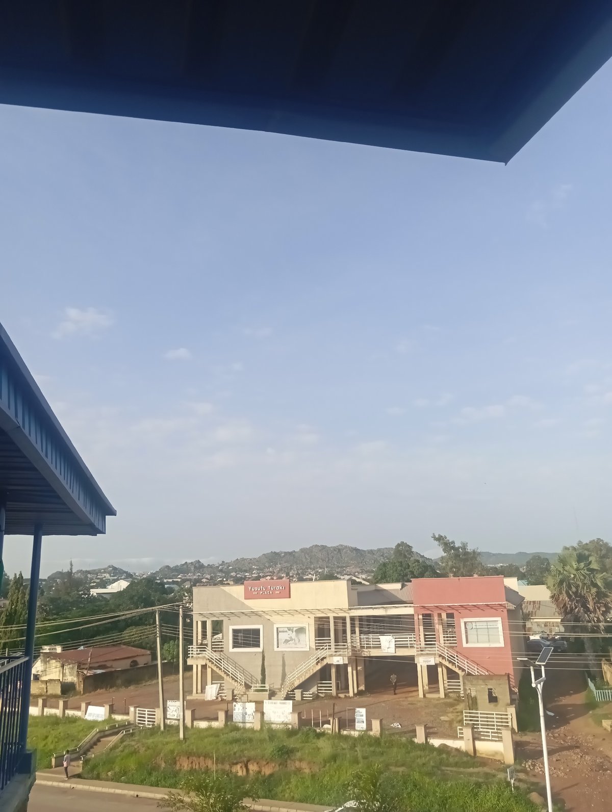 Morning views from a city balcony overlooking busy streets below