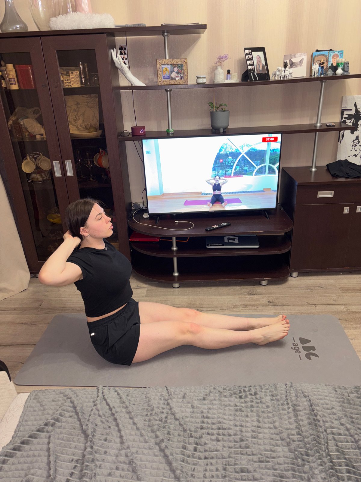 Woman combines yoga workout with strawberry snacks in Perm