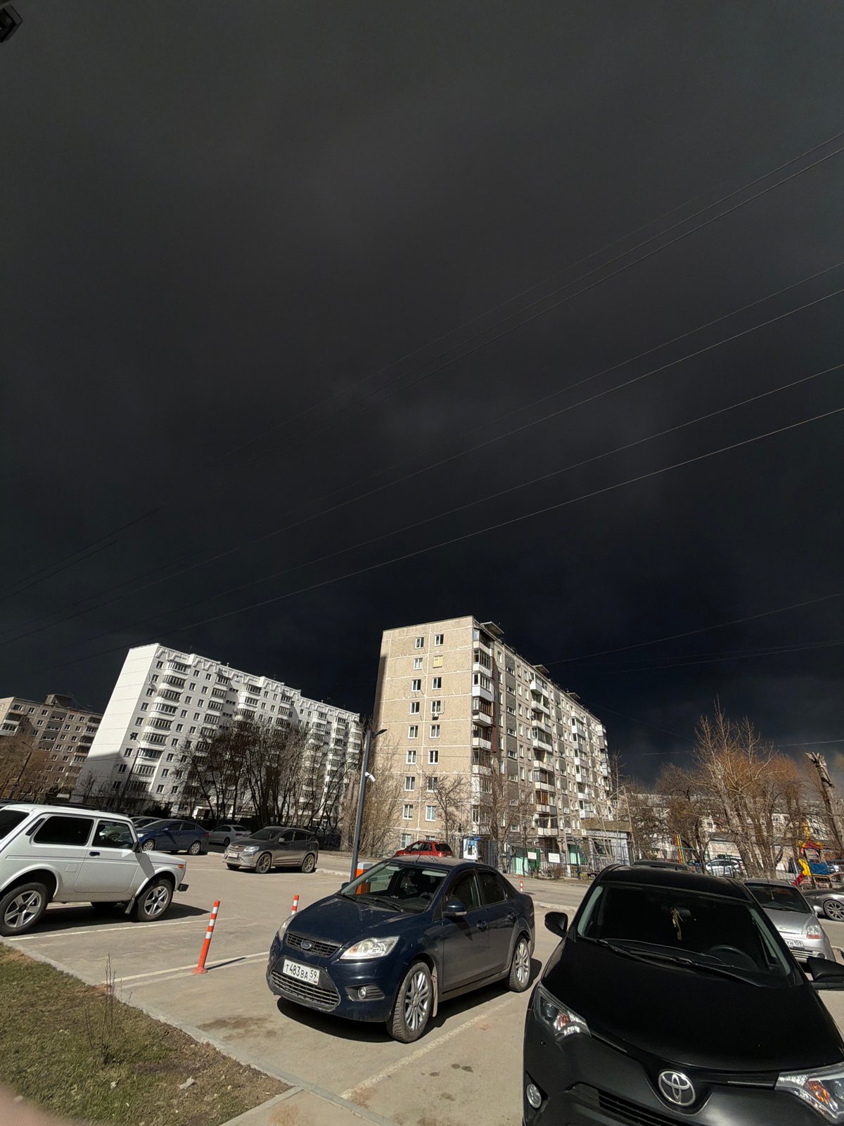 Dark storm clouds gather over Perm residential areas