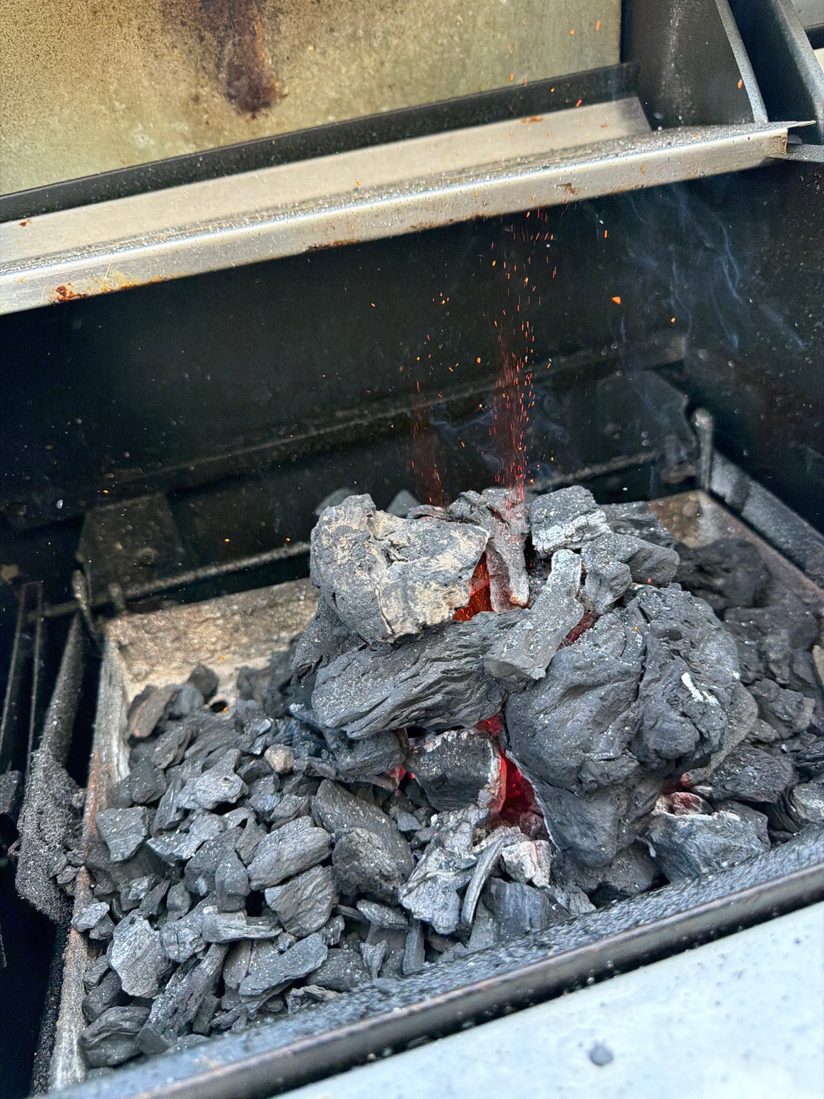Charcoal grill lighting up in Badalona, Spain
