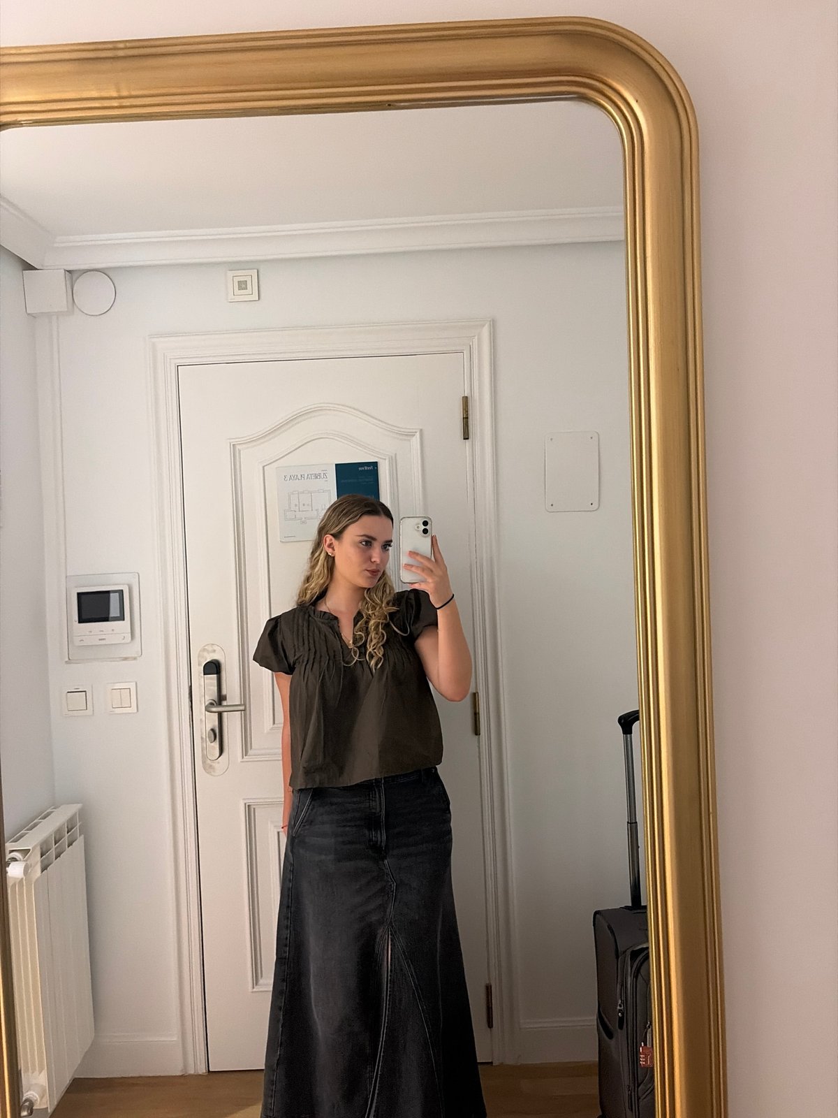 Woman takes selfie in ornate mirror at San Sebastián hotel
