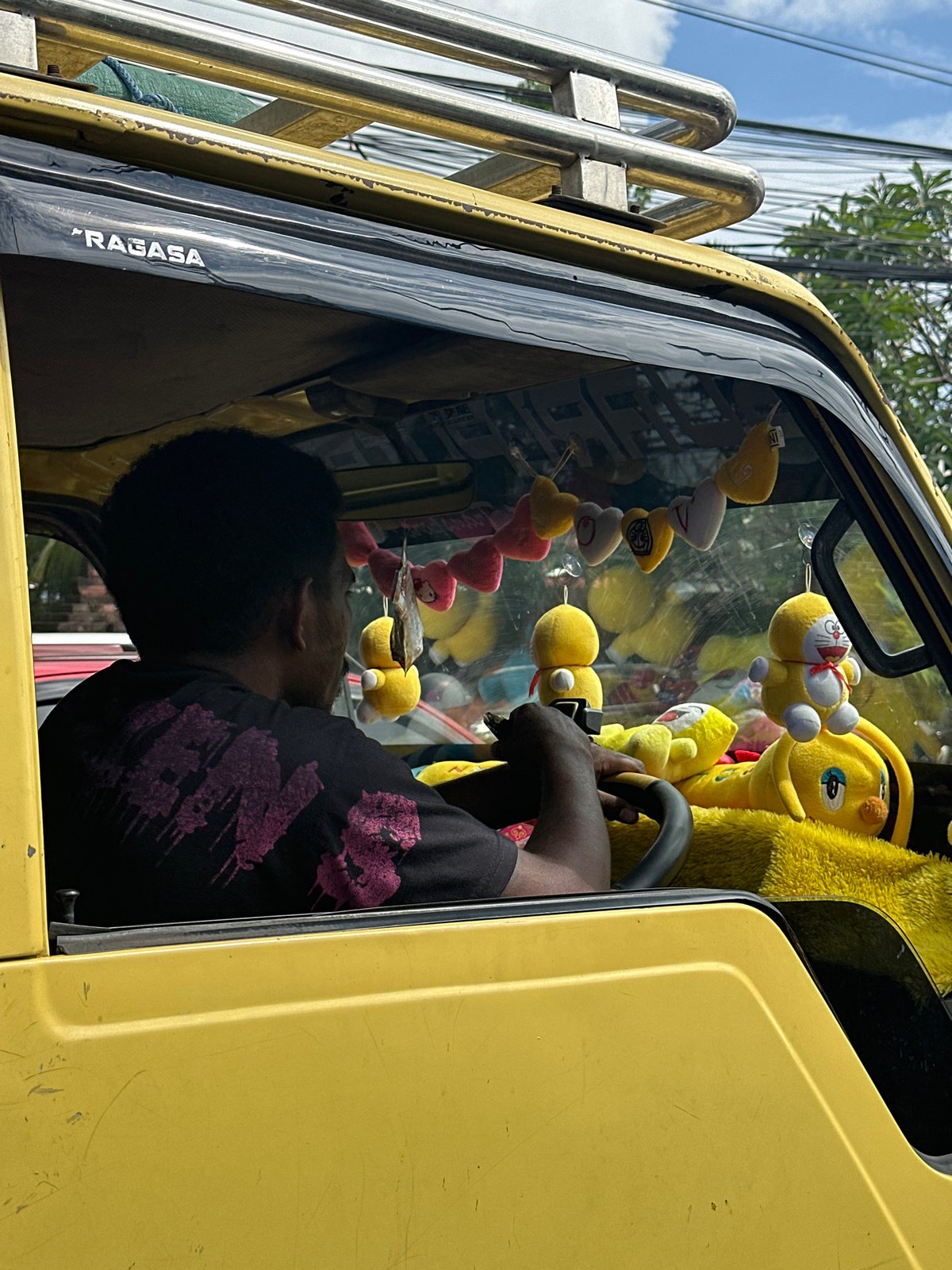 Driver spotted in yellow truck cab in Kuta Selatan
