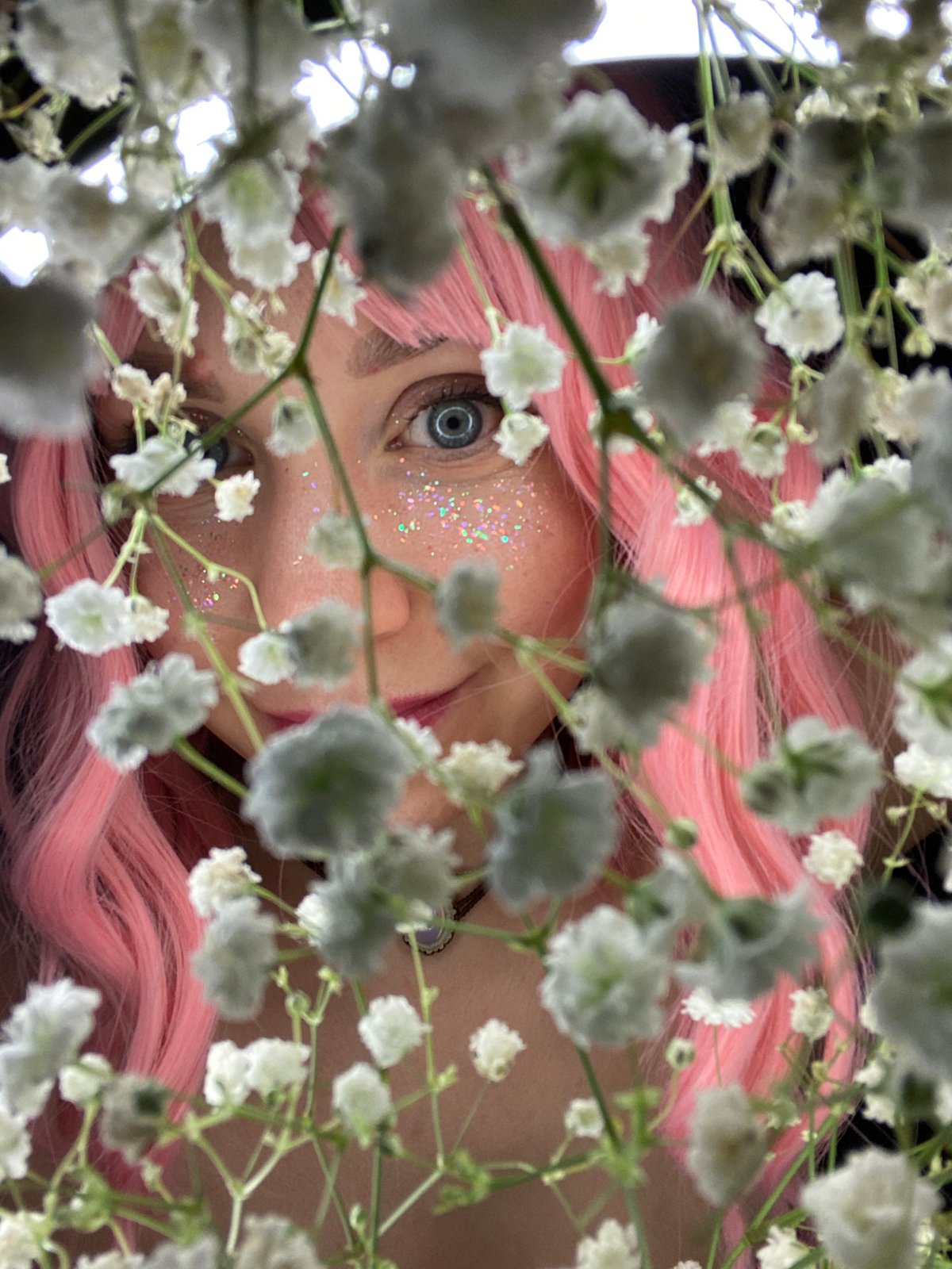 Pink-haired subject poses for artistic portraits in Chaikovsky