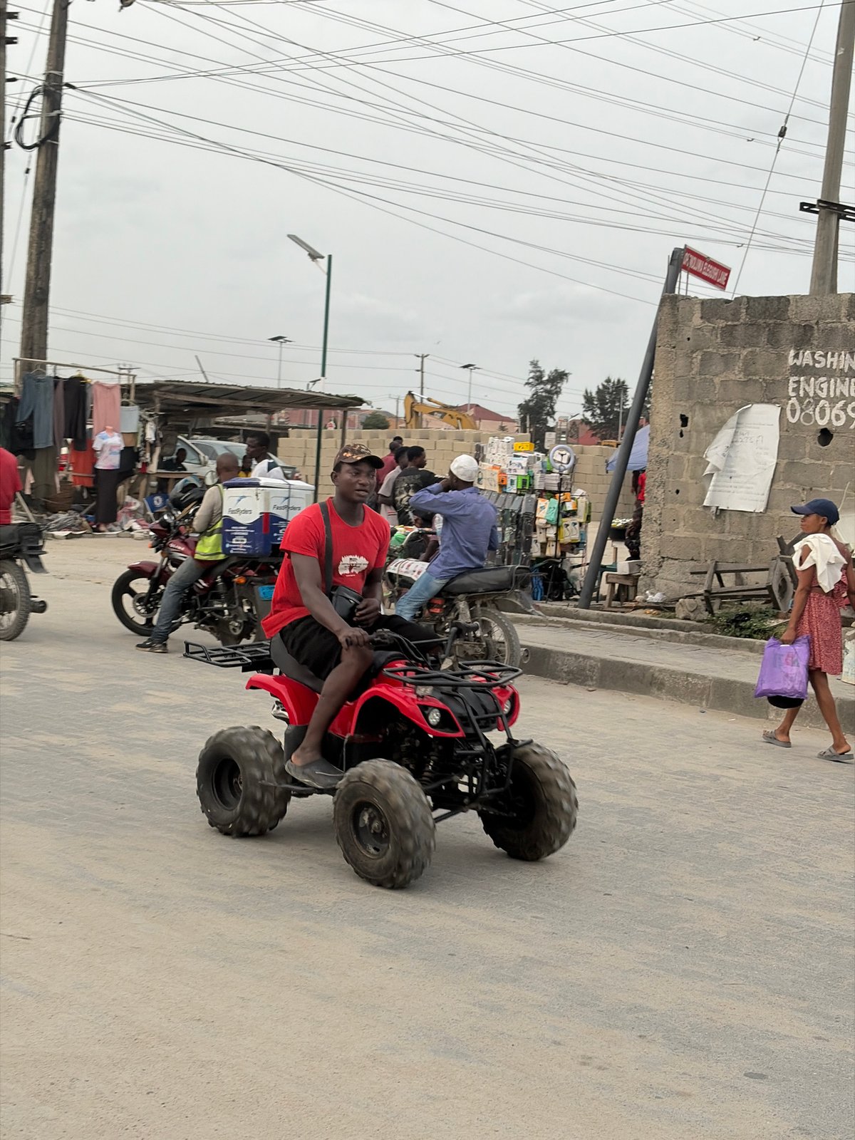 Urban street life documented in Nigerian towns Thursday evening