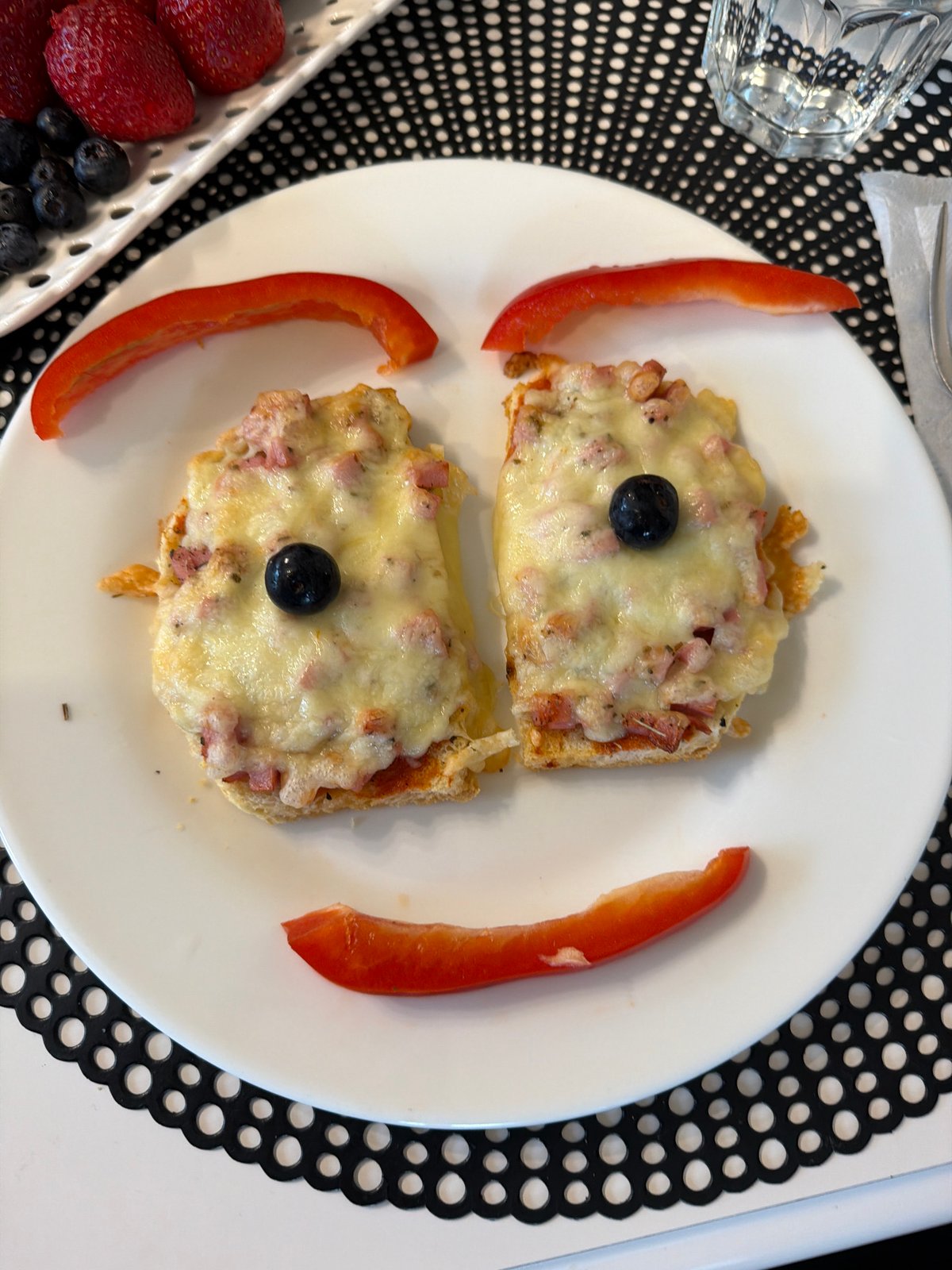Child enjoys face-shaped breakfast in Baloži, Latvia home