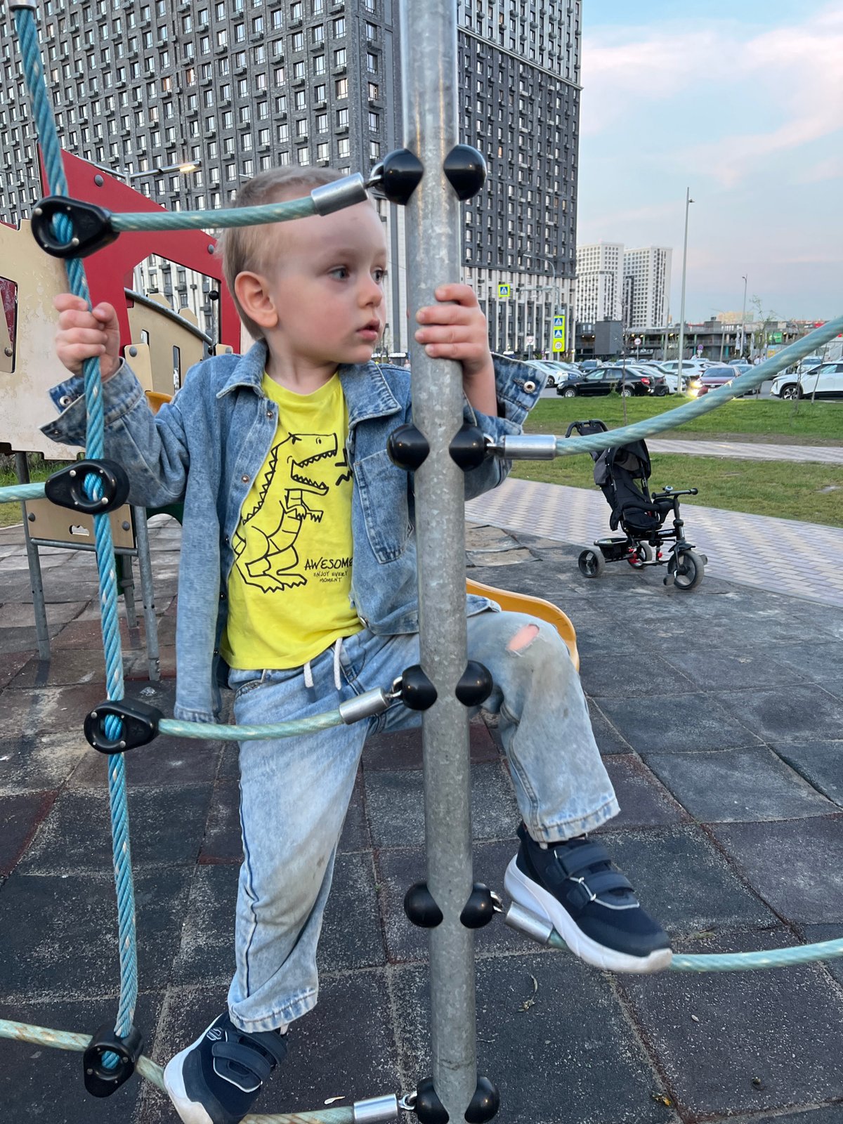 Child plays on playground equipment in Mytishchi, Russia