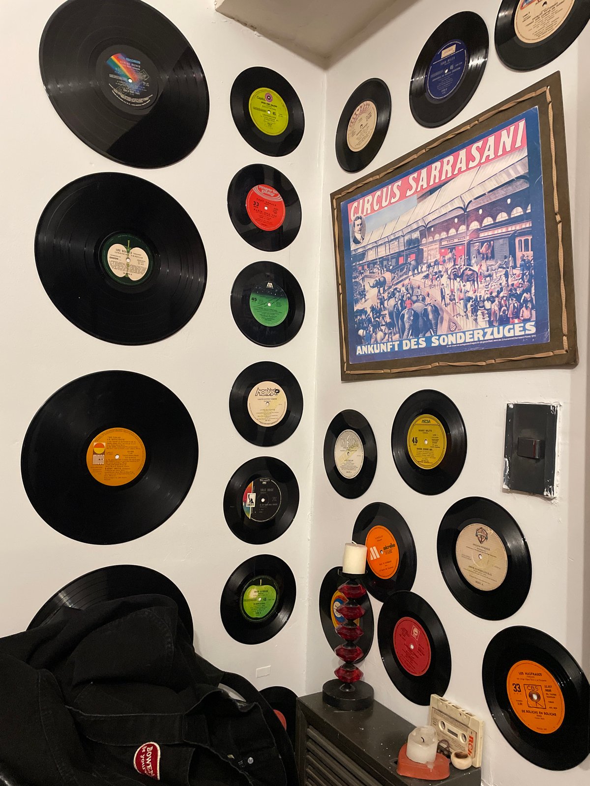 Vintage vinyl record collection displayed on Buenos Aires wall