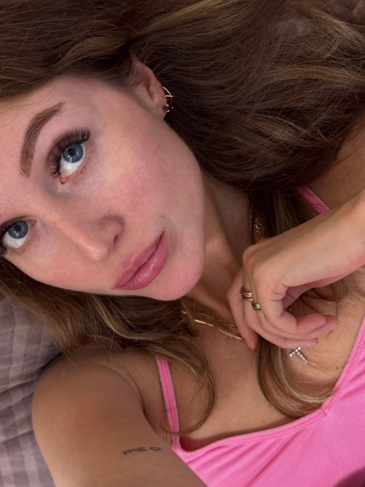 Woman takes selfies on bed in Chaikovsky, Russia