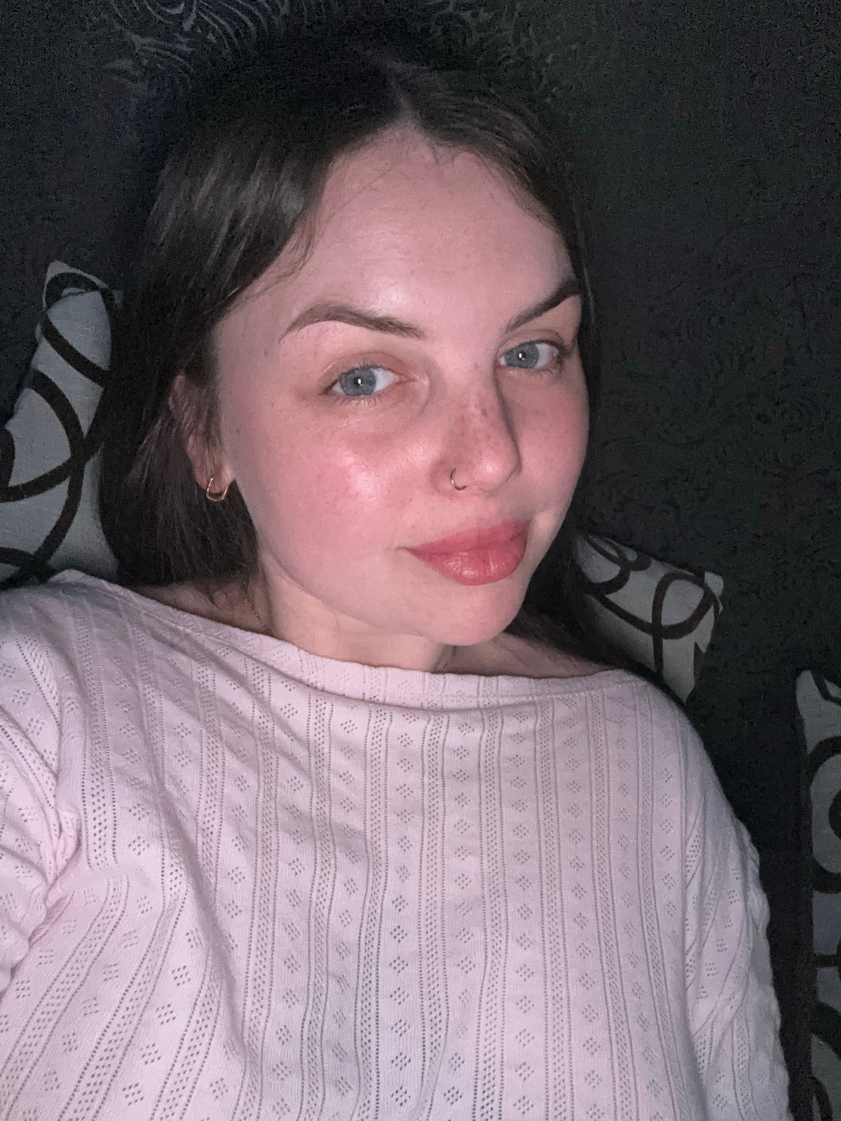 Person rests on sofa while watching YouTube in Ukrainian town