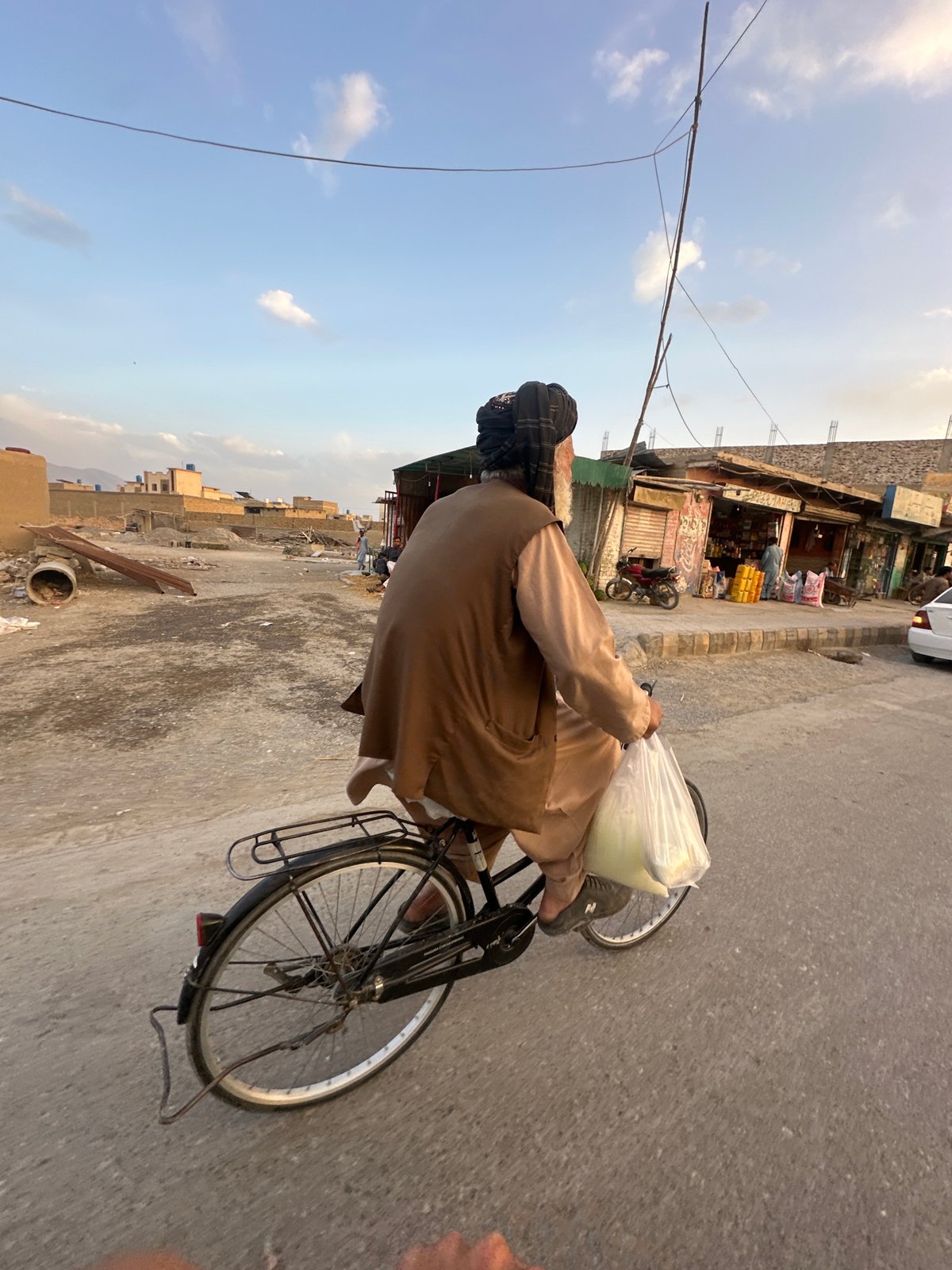 Cyclist spotted carrying bag through Quetta streets