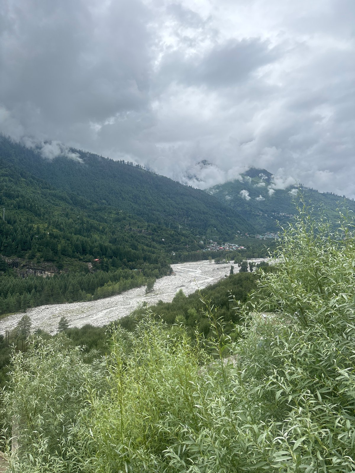 Overcast valley and hillside town views in Vashisht, India
