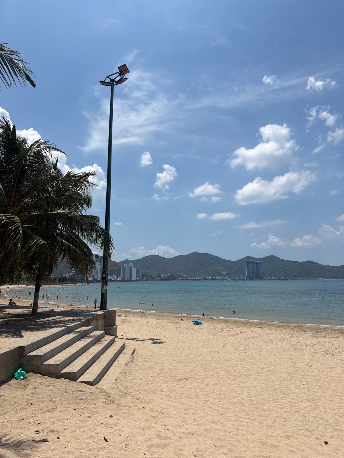Morning beach life and coastal traffic in Nha Trang