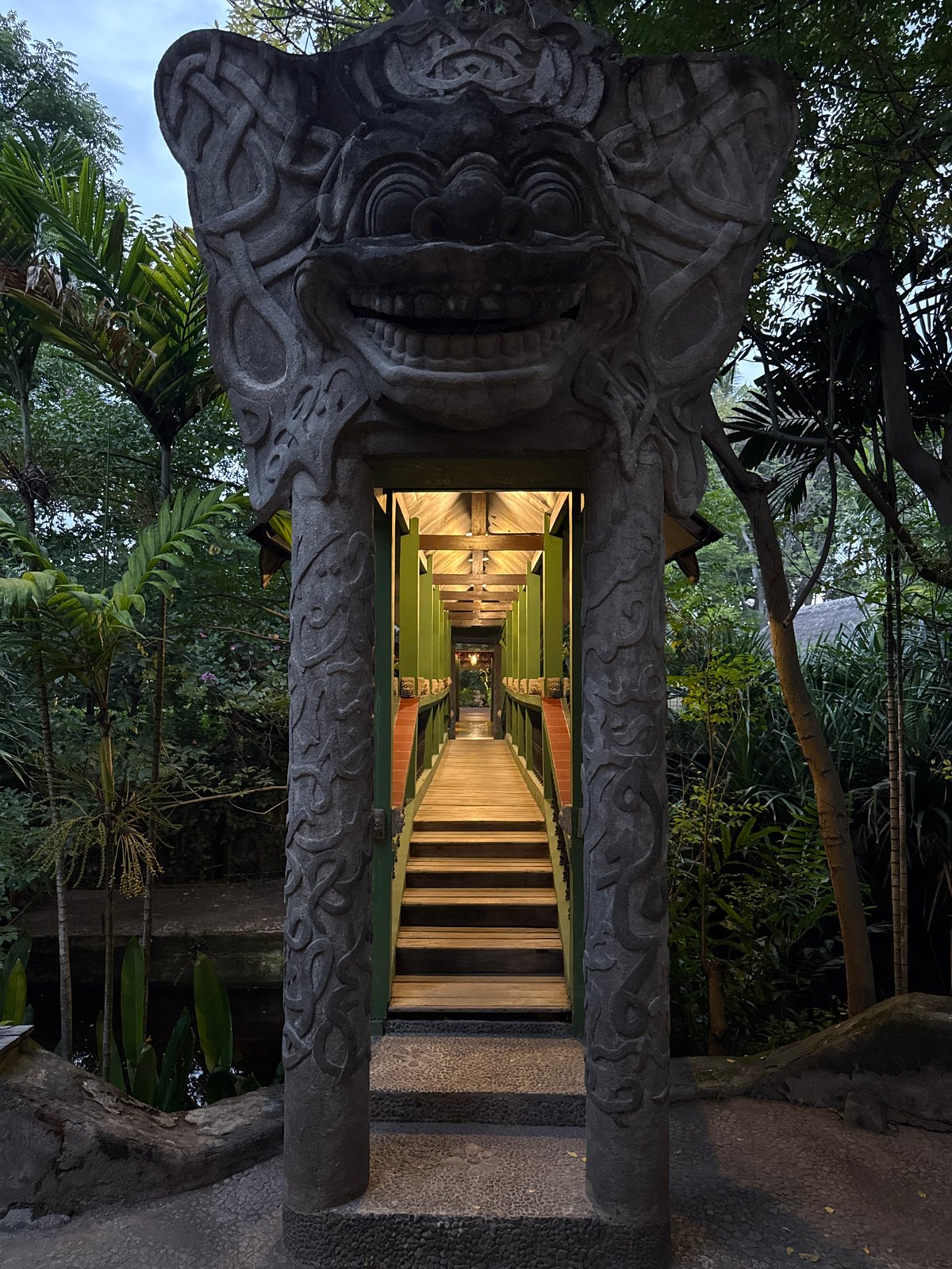 Indonesian location documented showing walkway, white building, palm trees