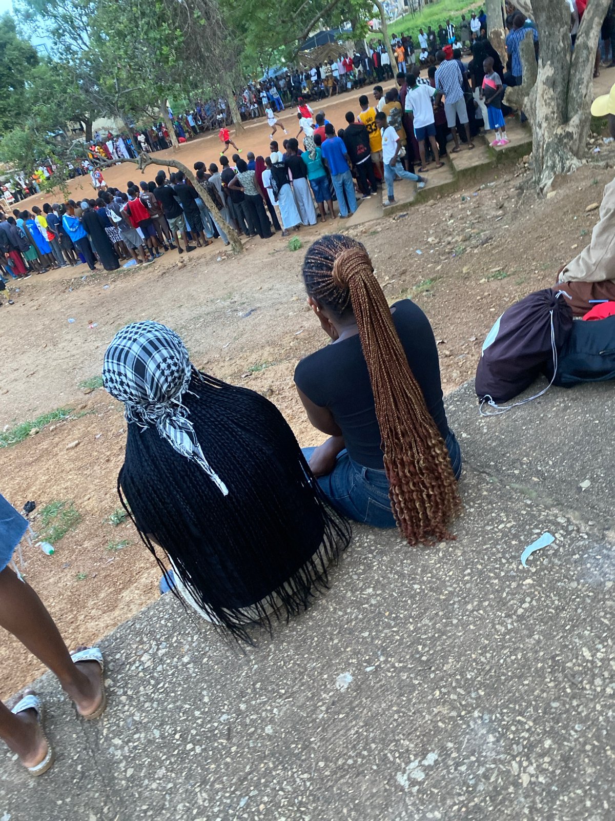 Afternoon street life and outdoor gathering in Rafin Par, Nigeria