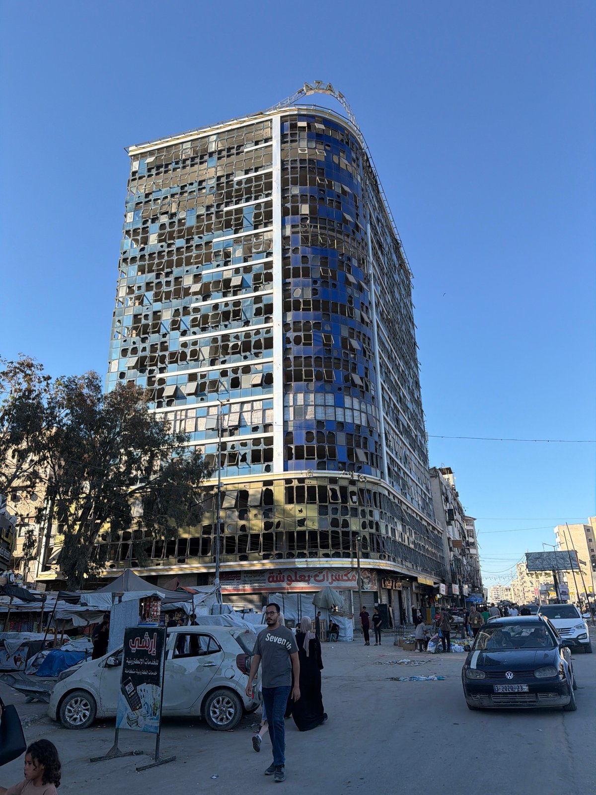 Gaza City streets and damaged buildings on a June afternoon