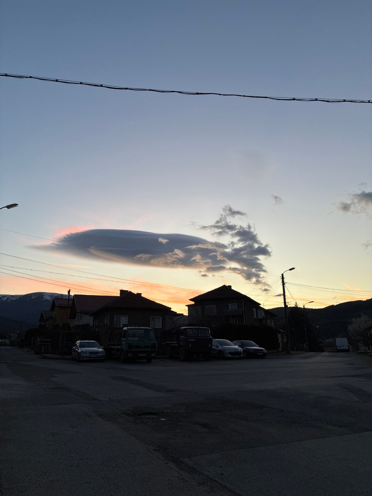 Dramatic lenticular cloud formation captured at sunset in Berkovitsa, Bulgaria