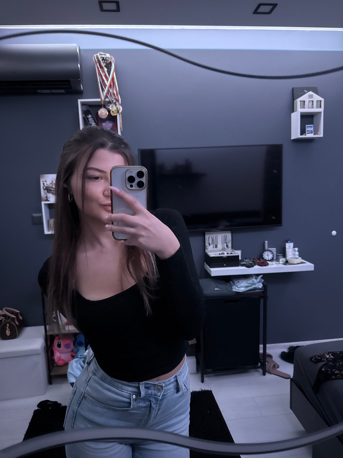 Woman takes mirror selfies in Sofia apartment Friday evening