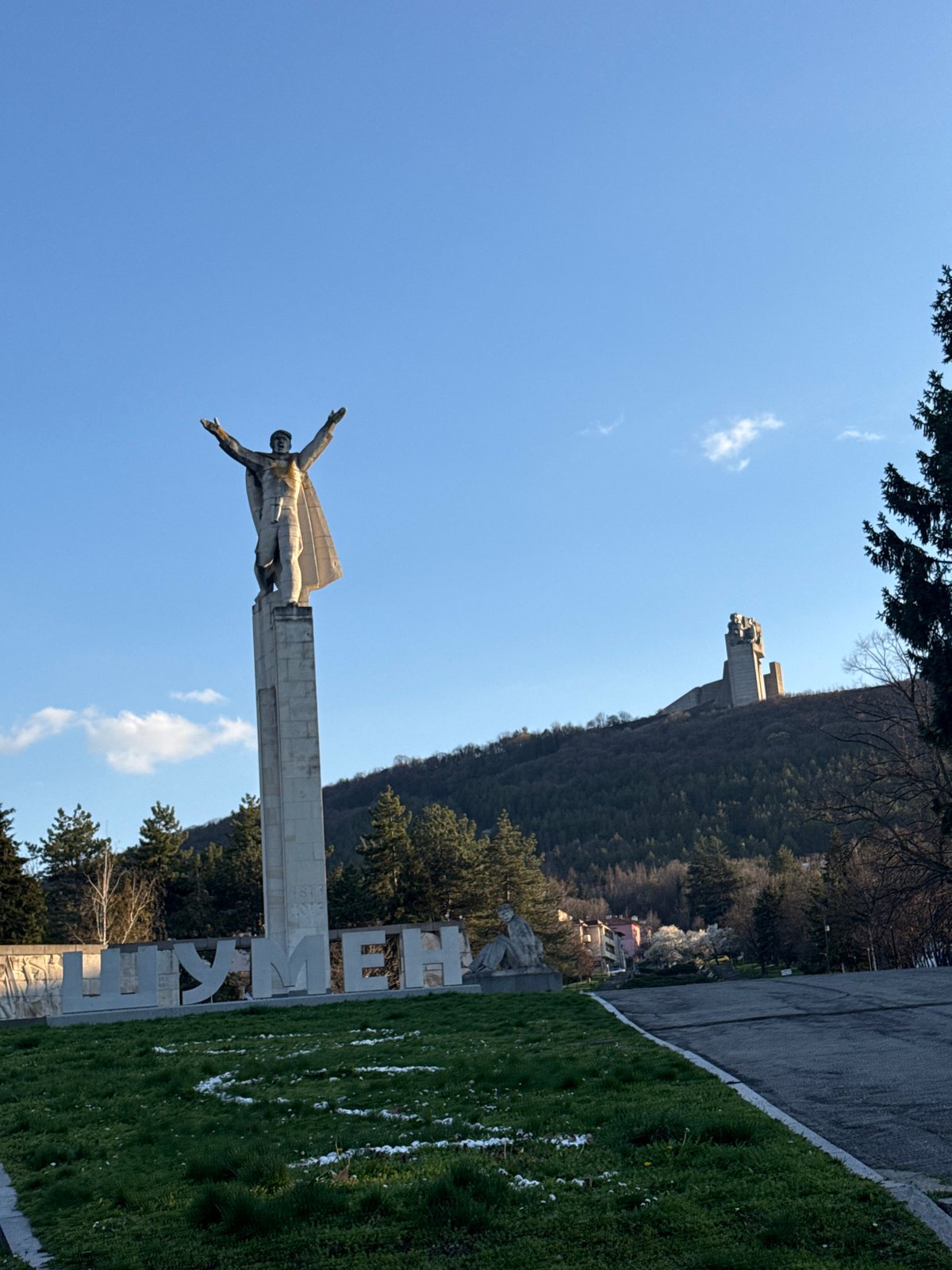 Tourist photographs historic Bulgarian monument in Shumen