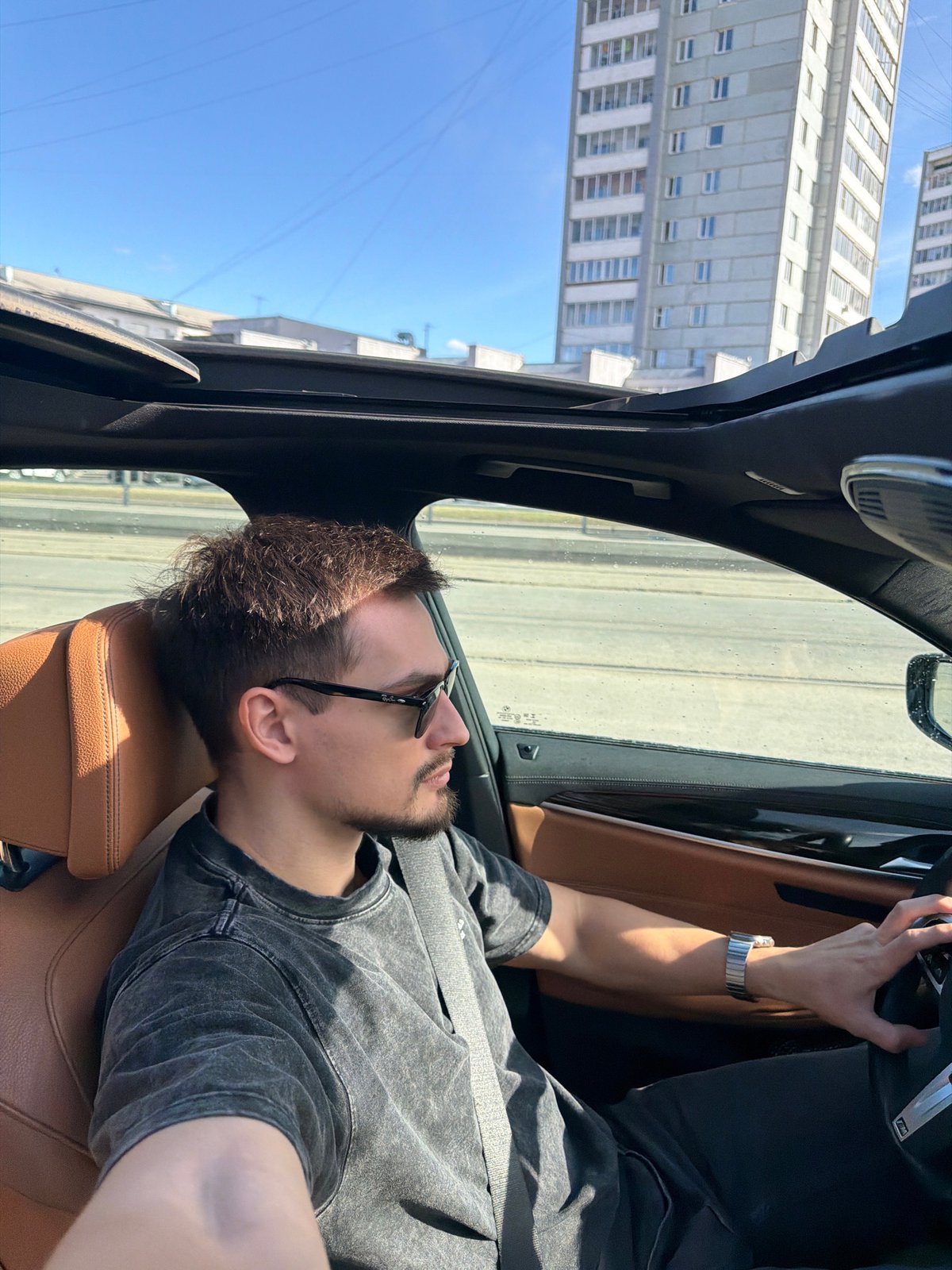 Man drives leather-interior car through Krasnoyarsk streets