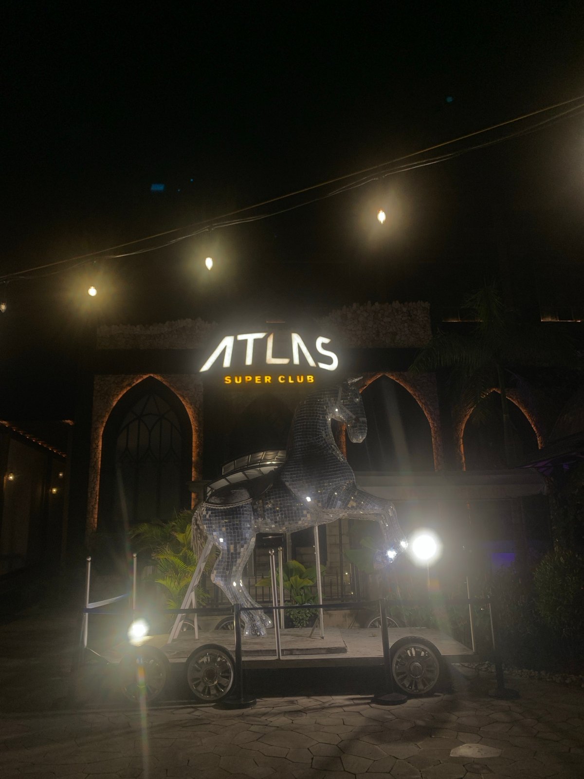 Atlas Super Club entrance illuminated at night in North Kuta